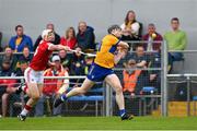 21 May 2023; Tony Kelly of Clare is tackled by Tommy O'Connell of Cork as he scores a first half point during the Munster GAA Hurling Senior Championship Round 4 match between Clare and Cork at Cusack Park in Ennis, Clare. Photo by Ray McManus/Sportsfile