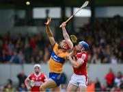 21 May 2023; Peter Duggan of Clare is tackled by Sean O'Donoghue of Cork during the Munster GAA Hurling Senior Championship Round 4 match between Clare and Cork at Cusack Park in Ennis, Clare.Photo by Ray McManus/Sportsfile