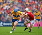 21 May 2023; Shane O'Donnell of Clare is tackled by Tommy O'Connell of Cork during the Munster GAA Hurling Senior Championship Round 4 match between Clare and Cork at Cusack Park in Ennis, Clare. Photo by Ray McManus/Sportsfile