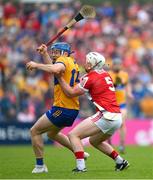 21 May 2023; Shane O'Donnell of Clare is tackled by Tommy O'Connell of Cork during the Munster GAA Hurling Senior Championship Round 4 match between Clare and Cork at Cusack Park in Ennis, Clare. Photo by Ray McManus/Sportsfile