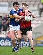 21 May 2023; Odhran Murdock of Down is dispossessed by Dan McCormack of Conall Kennedy of Tipperary during the Tailteann Cup Group 2 Round 2 match between Tipperary and Down at FBD Semple Stadium in Thurles, Tipperary. Photo by Brendan Moran/Sportsfile