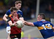 21 May 2023; Miceal Rooney of Down is tackled by Mark Russell of Tipperary during the Tailteann Cup Group 2 Round 2 match between Tipperary and Down at FBD Semple Stadium in Thurles, Tipperary. Photo by Brendan Moran/Sportsfile