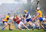 21 May 2023; Clare players, from left, Rory Hayes, Eibhear Quilligan and Conor Cleary in action against Patrick Horgan of Cork during the Munster GAA Hurling Senior Championship Round 4 match between Clare and Cork at Cusack Park in Ennis, Clare. Photo by John Sheridan/Sportsfile