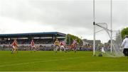 21 May 2023; Tony Kelly of Clare shoots past Sean O'Donoghue and Cork goalkeeper Patrick Collins to score a first half goal during the Munster GAA Hurling Senior Championship Round 4 match between Clare and Cork at Cusack Park in Ennis, Clare. Photo by Ray McManus/Sportsfile