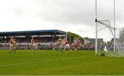 21 May 2023; Tony Kelly of Clare shoots past Sean O'Donoghue and Cork goalkeeper Patrick Collins to score a first half goal during the Munster GAA Hurling Senior Championship Round 4 match between Clare and Cork at Cusack Park in Ennis, Clare. Photo by Ray McManus/Sportsfile