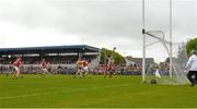 21 May 2023; Tony Kelly of Clare shoots past Sean O'Donoghue and Cork goalkeeper Patrick Collins to score a first half goal during the Munster GAA Hurling Senior Championship Round 4 match between Clare and Cork at Cusack Park in Ennis, Clare. Photo by Ray McManus/Sportsfile