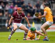 21 May 2023; Declan McLoughlin of Galway is tackled by Gerard Walsh, left, and Ryan Mc Garry of Antrim during the Leinster GAA Hurling Senior Championship Round 4 match between Galway and Antrim at Pearse Stadium in Galway. Photo by Tom Beary/Sportsfile