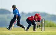 21 May 2023; Dragons wicket-keeper Amy Hunter and Typhoons batter Georgia Atkinson during the Evoke Super Series match between Dragons and Typhoons at Oak Hill Cricket Club in Kilbride, Wicklow. Photo by Seb Daly/Sportsfile