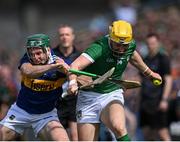 21 May 2023; Séamus Flanagan of Limerick is tackled by Cathal Barrett of Tipperary during the Munster GAA Hurling Senior Championship Round 4 match between Tipperary and Limerick at FBD Semple Stadium in Thurles, Tipperary. Photo by Piaras Ó Mídheach/Sportsfile