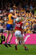 21 May 2023; Diarmuid Ryan of Clare catches the sliotar ahead of Cork's Shane Barrett in the last seconds of the Munster GAA Hurling Senior Championship Round 4 match between Clare and Cork at Cusack Park in Ennis, Clare. Photo by Ray McManus/Sportsfile