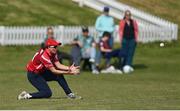 21 May 2023; Arlene Kelly of Dragons catches out Typhoons batter Georgia Atkinson in the outfield during the Evoke Super Series match between Dragons and Typhoons at Oak Hill Cricket Club in Kilbride, Wicklow. Photo by Seb Daly/Sportsfile