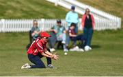21 May 2023; Arlene Kelly of Dragons catches out Typhoons batter Georgia Atkinson in the outfield during the Evoke Super Series match between Dragons and Typhoons at Oak Hill Cricket Club in Kilbride, Wicklow. Photo by Seb Daly/Sportsfile