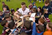 21 May 2023; Eanna Murphy of Galway signs autographs for young supporters after the Leinster GAA Hurling Senior Championship Round 4 match between Galway and Antrim at Pearse Stadium in Galway. Photo by Tom Beary/Sportsfile