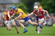 21 May 2023; Rory Hayes of Clare is tackled by Cork players, from left, Seamus Harnedy and Patrick Horgan during the Munster GAA Hurling Senior Championship Round 4 match between Clare and Cork at Cusack Park in Ennis, Clare. Photo by John Sheridan/Sportsfile