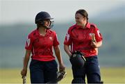 21 May 2023; Dragons batters Amy Hunter, left, and Molly Devine after their side's victory in the Evoke Super Series match between Dragons and Typhoons at Oak Hill Cricket Club in Kilbride, Wicklow. Photo by Seb Daly/Sportsfile