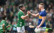 21 May 2023; Peter Casey of Limerick, left, and Michael Breen of Tipperary shake hands after the Munster GAA Hurling Senior Championship Round 4 match between Tipperary and Limerick at FBD Semple Stadium in Thurles, Tipperary. Photo by Brendan Moran/Sportsfile