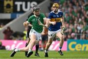 21 May 2023; Diarmaid Byrnes of Limerick in action against Jake Morris of Tipperary during the Munster GAA Hurling Senior Championship Round 4 match between Tipperary and Limerick at FBD Semple Stadium in Thurles, Tipperary. Photo by Brendan Moran/Sportsfile