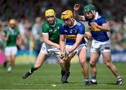 21 May 2023; Ronan Maher of Tipperary, supported by teammate Cathal Barrett of Tipperary, right, in action against Séamus Flanagan of Limerick during the Munster GAA Hurling Senior Championship Round 4 match between Tipperary and Limerick at FBD Semple Stadium in Thurles, Tipperary. Photo by Piaras Ó Mídheach/Sportsfile