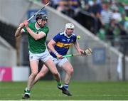 21 May 2023; Declan Hannon of Limerick scores a point under pressure from Séamus Kennedy of Tipperary during the Munster GAA Hurling Senior Championship Round 4 match between Tipperary and Limerick at FBD Semple Stadium in Thurles, Tipperary. Photo by Piaras Ó Mídheach/Sportsfile