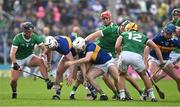 21 May 2023; Darragh O'Donovan of Limerick, left, competes for possession with Seamus Kennedy and Johnny Ryan of Tipperary during the Munster GAA Hurling Senior Championship Round 4 match between Tipperary and Limerick at FBD Semple Stadium in Thurles, Tipperary. Photo by Brendan Moran/Sportsfile