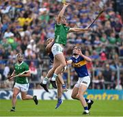21 May 2023; Diarmaid Byrnes of Limerick in action against Gearod O'Connor and Conor Stakelum of Tipperary during the Munster GAA Hurling Senior Championship Round 4 match between Tipperary and Limerick at FBD Semple Stadium in Thurles, Tipperary. Photo by Brendan Moran/Sportsfile