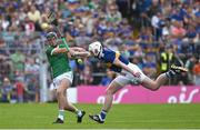 21 May 2023; Diarmaid Byrnes of Limerick has a clearance blocked by Seamus Kennedy of Tipperary during the Munster GAA Hurling Senior Championship Round 4 match between Tipperary and Limerick at FBD Semple Stadium in Thurles, Tipperary. Photo by Brendan Moran/Sportsfile