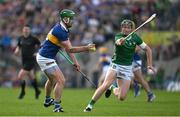 21 May 2023; Noel McGrath of Tipperary handpasses the sliotar past William O'Donoghue of Limerick during the Munster GAA Hurling Senior Championship Round 4 match between Tipperary and Limerick at FBD Semple Stadium in Thurles, Tipperary. Photo by Brendan Moran/Sportsfile