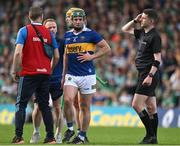 21 May 2023; Referee Sean Stack signals for Cathal Barrett of Tipperary to leave the pitch for medical treatment during the Munster GAA Hurling Senior Championship Round 4 match between Tipperary and Limerick at FBD Semple Stadium in Thurles, Tipperary. Photo by Brendan Moran/Sportsfile