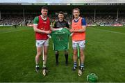 21 May 2023; Limerick captain Declan Hannon makes a presentation of a special training jersey for the Dillon Quirke Foundation to Tipperary captain Noel McGrath, in the company of referee Sean Stack, before the Munster GAA Hurling Senior Championship Round 4 match between Tipperary and Limerick at FBD Semple Stadium in Thurles, Tipperary. Photo by Brendan Moran/Sportsfile