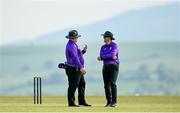 21 May 2023; Umpire Willie Clarke, left, and Aidan Seaver during the Evoke Super Series match between Dragons and Typhoons at Oak Hill Cricket Club in Kilbride, Wicklow. Photo by Seb Daly/Sportsfile