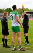 20 May 2023; Sideline official Timmy McGrath, left, looks on as Rory O'Donnell of Donegal, who had to remove his torn jersey, is spoken to by referee James Molloy before issuing him a yellow card during the GAA Football All-Ireland Senior Championship Round 1 match between Clare and Donegal at Cusack Park in Ennis, Clare. Photo by Ray McManus/Sportsfile