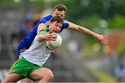 20 May 2023;Conor O'Donnell of Donegal is tackled by Darragh Bohannon of Clare during the GAA Football All-Ireland Senior Championship Round 1 match between Clare and Donegal at Cusack Park in Ennis, Clare. Photo by Ray McManus/Sportsfile