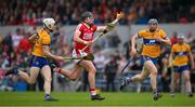 21 May 2023; Darragh Fitzgibbon of Cork is tackled by Ryan Taylor, left, and David McInerney of Clare during the Munster GAA Hurling Senior Championship Round 4 match between Clare and Cork at Cusack Park in Ennis, Clare. Photo by Ray McManus/Sportsfile