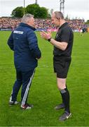 21 May 2023; Referee Johnny Murphy and Cork manager Pat Ryan in conversation the Munster GAA Hurling Senior Championship Round 4 match between Clare and Cork at Cusack Park in Ennis, Clare. Photo by Ray McManus/Sportsfile