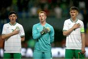 23 May 2023; Republic of Ireland players, from left, Cory O'Sullivan, Jason Healy and Freddie Turley during the national anthem before the UEFA European U17 Championship Final Tournament match between Hungary and Republic of Ireland at Pancho Aréna in Felcsút, Hungary. Photo by David Balogh/Sportsfile