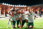 23 May 2023; Luke Kehir of Republic of Ireland, left, celebrates with teammates, from left to right, Daniel Babb, Mason Melia, Daniel McGrath and Najemedine Razi after scoring his side's fourth goal during the UEFA European U17 Championship Final Tournament match between Hungary and Republic of Ireland at Pancho Aréna in Felcsút, Hungary. Photo by David Balogh/Sportsfile