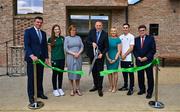 25 May 2023; Minister of State at Department of Tourism, Culture, Arts, Gaeltacht, Sport and Media Thomas Byrne TD, cuts the ribbon during the official opening of the new Olympic Federation of Ireland offices at the Sport Ireland Campus in Dublin, in the company of, from left, Olympic Federation of Ireland chief executive Peter Sherrard, Olympian Emily Hegarty, Sport Ireland chief executive Dr Una May, Olympic Federation of Ireland president Sarah Keane, Olympian Aidan Walsh and Sport Ireland Chairman John Foley. Photo by Brendan Moran/Sportsfile