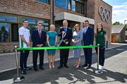 25 May 2023; Minister of State at Department of Tourism, Culture, Arts, Gaeltacht, Sport and Media Thomas Byrne TD, cuts the ribbon during the official opening of the new Olympic Federation of Ireland offices at the Sport Ireland Campus in Dublin, in the company of, from left, Olympian Aidan Walsh, Sport Ireland Chairman John Foley, Olympic Federation of Ireland president Sarah Keane, Sport Ireland chief executive Dr Una May, Olympic Federation of Ireland chief executive Peter Sherrard and Olympian Emily Hegarty. Photo by Brendan Moran/Sportsfile