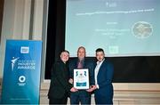 25 May 2023; TG4 Head of Sport Ronán O Coisdealbha is presented with his award for Best Sports Coverage, the Jimmy Magee Award, by James, left, and Christopher Magee, grandsons of Jimmy Magee, during the Federation of Irish Sport 2023 Irish Sport Industry Awards, in association with Financial Broker, at The Westin Hotel in Dublin. Photo by Brendan Moran/Sportsfile