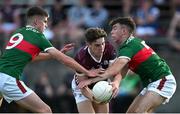 26 May 2023; Olan Kelly of Galway in action against Shane Cunningham, left, and Jamie Clarke of Mayo during the 2023 Electric Ireland Connacht GAA Football Minor Championship Final between Galway and Mayo at Tuam Stadium in Galway. Photo by Ray Ryan/Sportsfile