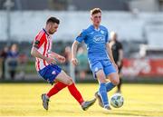 26 May 2023; Kevin Jordan of Finn Harps in action against Stephen Christopher of Treaty United during the SSE Airtricity Men's First Division match between Treaty United and Finn Harps at Markets Field in Limerick. Photo by Michael P Ryan/Sportsfile