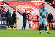 26 May 2023; Jake Mulraney of St Patrick's Athletic is consoled by St Patrick's Athletic manager Jon Daly after being shown a red card by referee Ray Matthews during the SSE Airtricity Men's Premier Division match between St Patrick's Athletic and Dundalk at Richmond Park in Dublin. Photo by Tyler Miller/Sportsfile