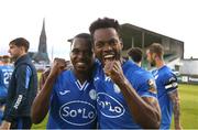 26 May 2023; Finn Harps players Noe Baba, right, and Katlego Mashigo celebrate after their side's victory in the SSE Airtricity Men's First Division match between Treaty United and Finn Harps at Markets Field in Limerick. Photo by Michael P Ryan/Sportsfile