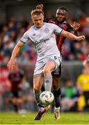 26 May 2023; Jonathan Lunney of Shelbourne in action against James Akintunde of Bohemians during the SSE Airtricity Men's Premier Division match between Bohemians and Shelbourne at Dalymount Park in Dublin. Photo by Seb Daly/Sportsfile