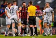 26 May 2023; Jordan Flores of Bohemians, centre, and Luke Byrne of Shelbourne, right, remonstrate with referee Damien MacGraith during the SSE Airtricity Men's Premier Division match between Bohemians and Shelbourne at Dalymount Park in Dublin. Photo by Seb Daly/Sportsfile