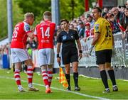 26 May 2023; St Patrick's Athletic players, from left, Jay McGrath, Mark Doyle, and Dean Lyness protest to assistant referee Michelle O'Neill after Jake Mulraney, not seen, is shown a red card during the SSE Airtricity Men's Premier Division match between St Patrick's Athletic and Dundalk at Richmond Park in Dublin. Photo by Tyler Miller/Sportsfile