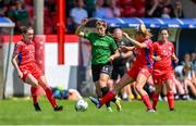 27 May 2023; Jessica Fitzgerald of Peamount United is tackled by Nadine Clare of Shelbourne as teammate Rachel Graham watches on during the SSE Airtricity Women's Premier Division match between Shelbourne and Peamount United at Tolka Park in Dublin. Photo by Tyler Miller/Sportsfile