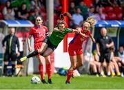 27 May 2023; Jessica Fitzgerald of Peamount United is tackled by Nadine Clare of Shelbourne as teammate Rachel Graham watches on during the SSE Airtricity Women's Premier Division match between Shelbourne and Peamount United at Tolka Park in Dublin. Photo by Tyler Miller/Sportsfile