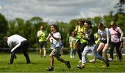 27 May 2023; Ukrainian volunteers and young children competing in a egg-and-spoon race during the Community Games Indoor Team and Cross Country Finals at Gormanston College in Gormanston, Meath. Photo by Eóin Noonan/Sportsfile