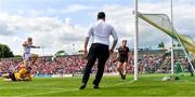 27 May 2023; Brian O'Driscoll of Cork jumps over Louth goalkeeper James Califf after scoring his side's first goal during the GAA Football All-Ireland Senior Championship Round 1 match between Louth and Cork at Páirc Tailteann in Navan, Meath. Photo by Seb Daly/Sportsfile